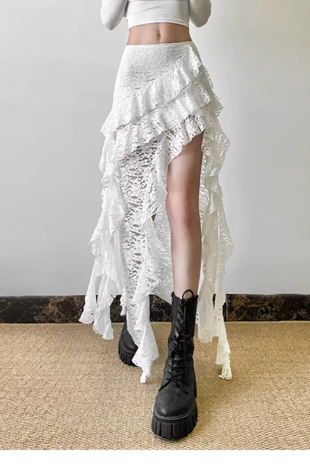 Pure and alluring textured high-waisted midi skirt with ruffled hem, slimming and asymmetrical design. 11460