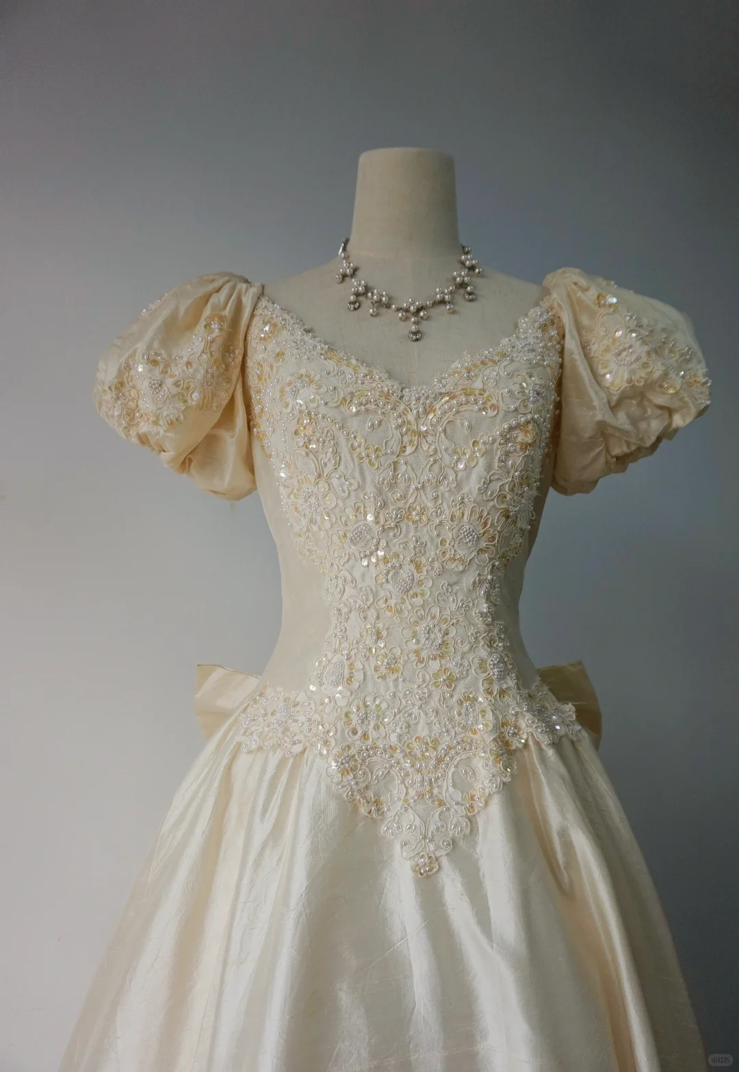 Light Champagne Vintage Wedding Gown, V‑Neck Puff Short Sleeves, Heavy Beaded Sequin Floral Lace Applique, Large Back Satin Bow, Satin Ball Gown Skirt, Bridal Prom Dress gh8914