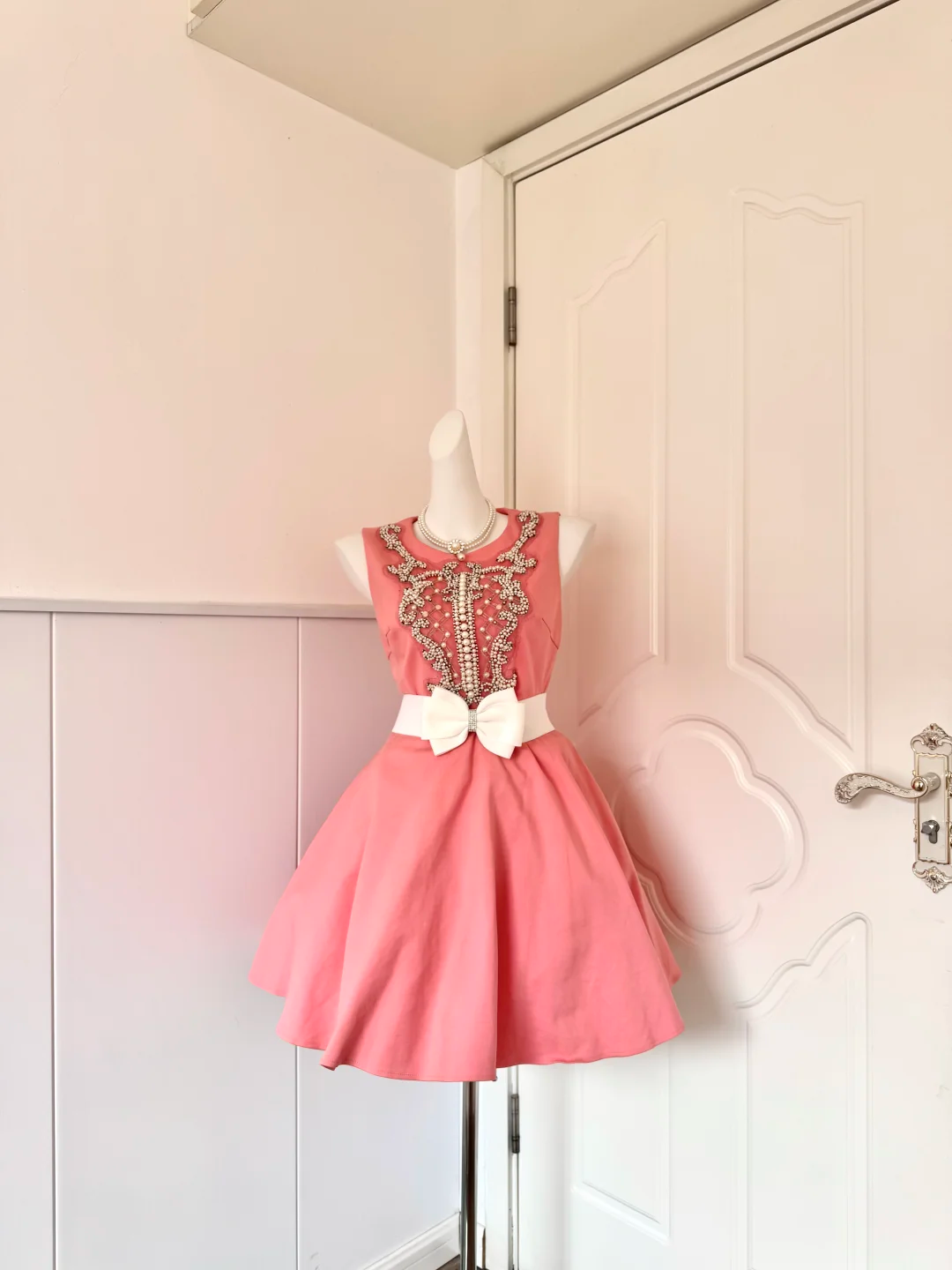 Women Peach Pink Homecoming Dress, Sleeveless Round Neck Ornate Silver Beaded Bodice White Satin Bow Waist Sash Voluminous Flared A‑Line Mini Party Dress gh9212