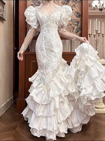White Vintage Satin Mermaid Wedding Gown, V‑Neck Big Puff Short Sleeves, Sheer Lace Embroidered Long Sleeves, Full‑Body Lace Appliqués Fitted Mermaid Silhouette, Multi‑Layer Ruffle Tiered Mermaid Skirt, Prom & Wedding Dress gh8670