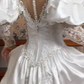 White Vintage Satin Wedding Gown, High Neck Tassel Lace Collar, Off‑the‑Shoulder Puff Sleeves With Sheer Lace Long Sleeves, Sweetheart Neck, Heavy Lace Appliqués Fitted Bodice, A‑Line Satin Long Train With Scalloped Lace Hem, Prom Dress gh8663
