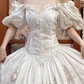 Ivory Vintage Satin Ball Gown Wedding Prom Dress, Sweetheart V‑Neck Puff Sleeves With Bows, Floral Lace Appliqués, Multi‑Tier Lace Cake Hem gh8710