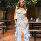 Robe de soirée longue à bretelles spaghetti et motif floral bleu charmant gh3009