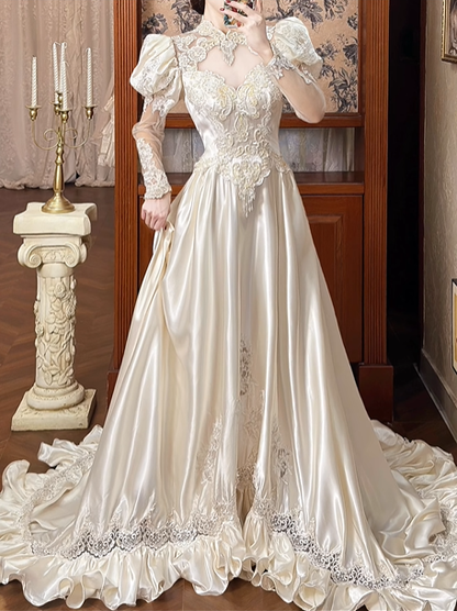 Champagne Vintage Satin Wedding Gown, Illusion Lace High Neck Over Sweetheart Neck, Puff Shoulder Lace Long Sleeves, Gold‑Thread Lace Appliqué Pointed Waist, A‑Line Satin Long Train With Ruffle Lace Hem, Prom Dress gh8651