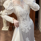 White Vintage Satin Mermaid Wedding Prom Dress, Lace High Neck Illusion V‑Neck, Leg‑of‑Mutton Puff Sleeves, Heart‑Shape Lace Appliqués, Scalloped Lace Long Train gh8680