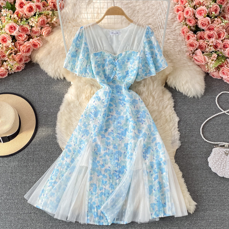 Robe trapèze en mousseline de soie à col en V et mailles cousues en mailles bleues 3219