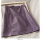 Jupe en cuir taille haute fine en forme de A, rétro et polyvalente, couleur unie 2542