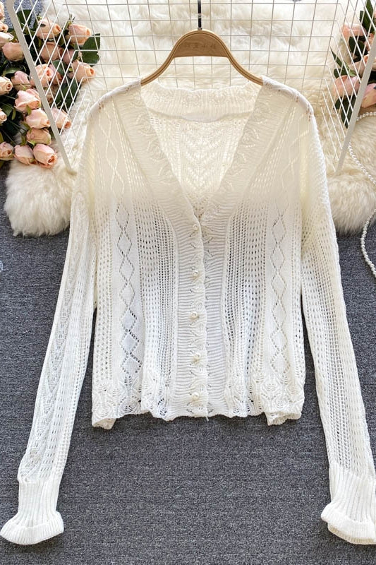 Un vent doux porte un manteau cardigan tricoté creux à fleurs à crochet vintage 1580