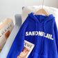 Pull ample à capuche bleu Klein 5076