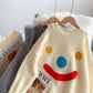 Pull ample à visage souriant Pull ample à visage souriant 4948