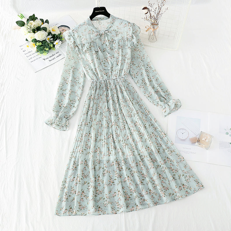 La robe en mousseline de soie à nœud montre un tempérament mince, une jupe florale plissée mince 4089